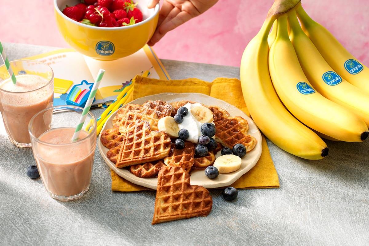 Chiquita banana waffles with blueberries and whipped cream