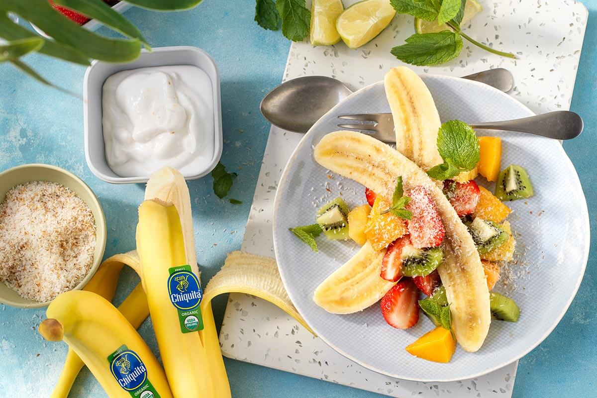 Tropical organic Chiquita banana split with coconut and mint