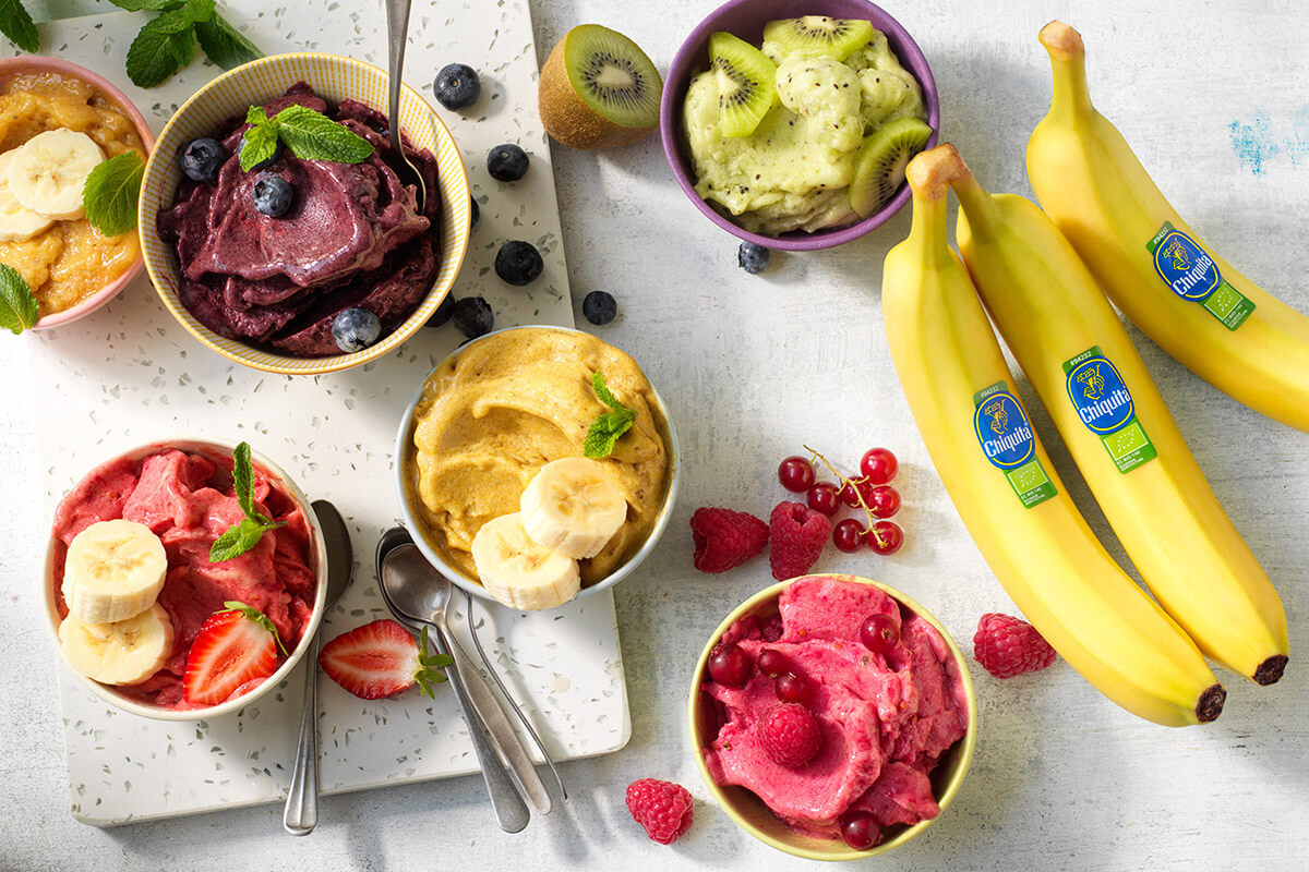 Vegan ice cream with Chiquita banana scoops, matcha, kiwi and berries